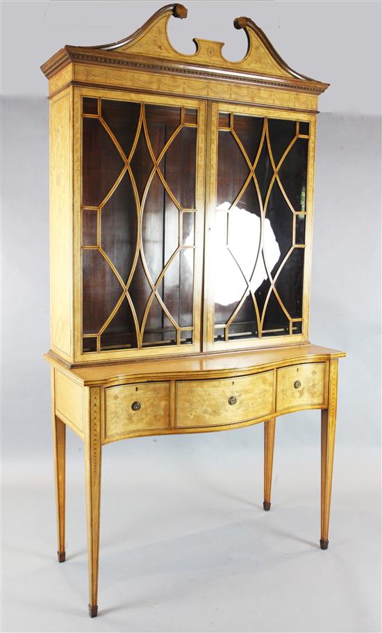 An Edwardian Sheraton Revival marquetry inlaid satinwood bookcase, W.3ft 9in. D.1ft 9in. H.7ft 3in.